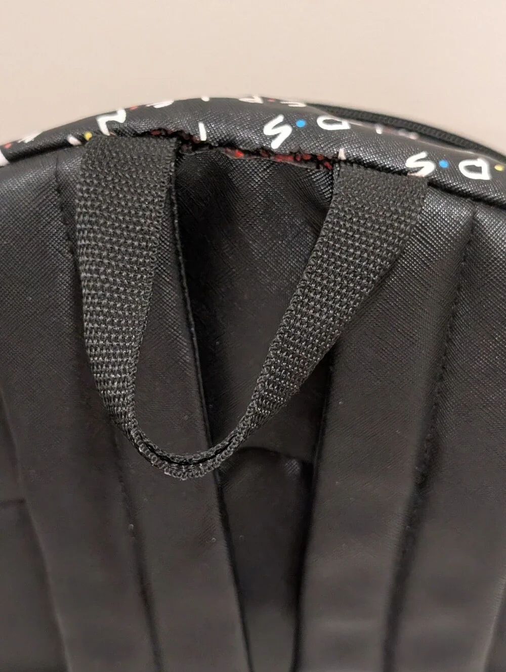 Friends Backpack all over print. need small repair see zoomed in photo